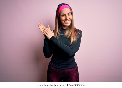 Young blonde fitness woman wearing sport workout clothes over isolated background clapping and applauding happy and joyful, smiling proud hands together - Powered by Shutterstock