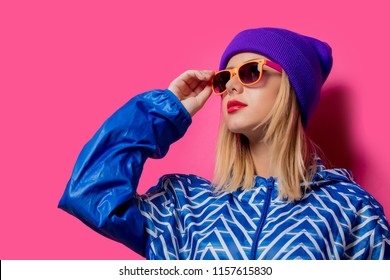Young Blonde Girl In 80s Style Clothes On Pink Background