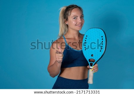 Young blonde girl athlete, sweating after training. Strong and powerful. In studio.