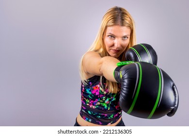 Young Blonde Girl Boxer Exercising Her Fists