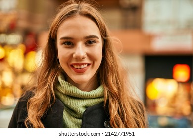 Young Blonde Girl Smiling Happy Standing At The City.