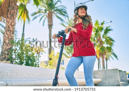 Image, Stock Photo Girl using electric scooter in the street in downtown rented by using service on smartphone. Candid people, real moments, authentic situations