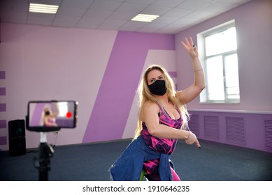 A Young Blonde Girl The Trainer Of A Zumba Wears A Black Mask During A Pandemic Leads Training Sessions In A Port Club