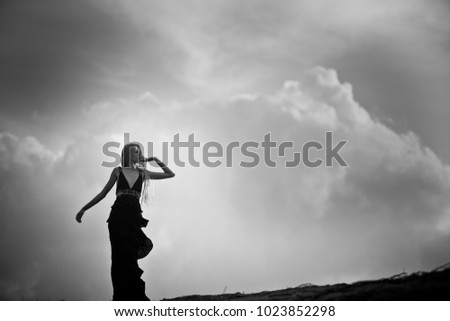 Similar – beautiful brunette short hair girl leaning on gray rock wall outdoors smiling happy