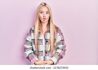 Young Blonde Girl Wearing Casual Clothes Making Fish Face With Lips, Crazy And Comical Gesture. Funny Expression. 