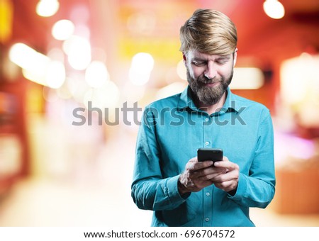 young blonde man with mobile phone. happy expression 