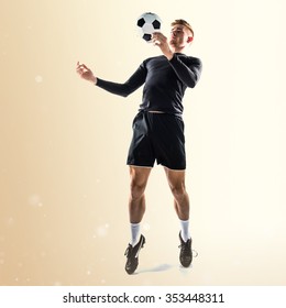 Young Blonde Man Playing Football