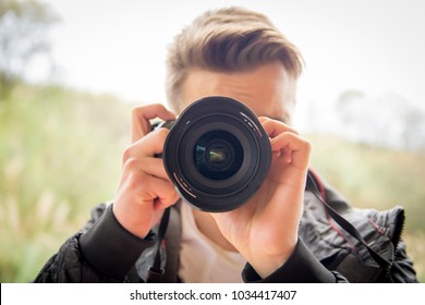 Young Blonde Man Shooting Photos