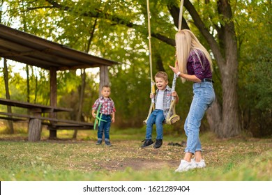 Parents Pushing Child On Swing Hd Stock Images Shutterstock