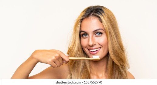 Young Blonde Woman Brushing Her Teeth