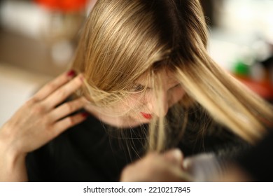 Young Blonde Woman Demonstrates Regrown Hair Roots