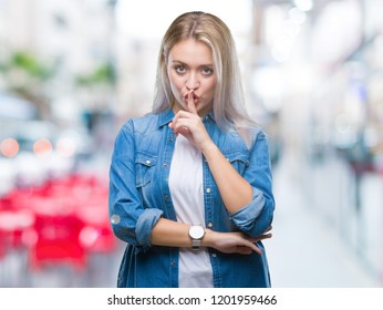 Young Blonde Woman Over Isolated Background Asking To Be Quiet With Finger On Lips. Silence And Secret Concept.