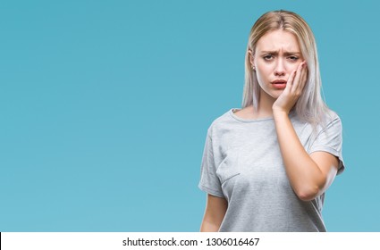 Young Blonde Woman Over Isolated Background Touching Mouth With Hand With Painful Expression Because Of Toothache Or Dental Illness On Teeth. Dentist Concept.