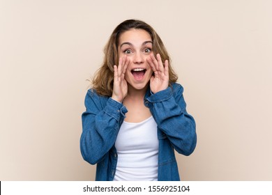 Young Blonde Woman Over Isolated Background Shouting With Mouth Wide Open