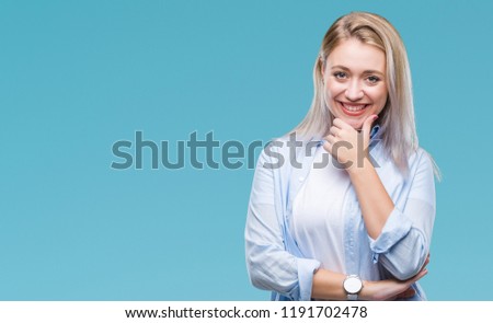 Young blonde woman over isolated background looking confident at the camera with smile with crossed arms and hand raised on chin. Thinking positive.