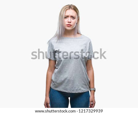 Young blonde woman over isolated background skeptic and nervous, frowning upset because of problem. Negative person.