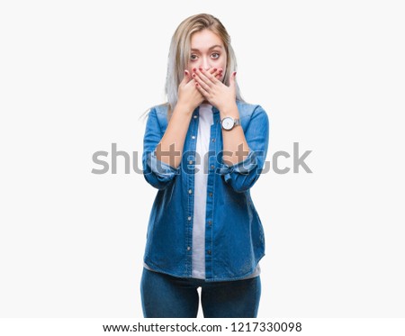 Young blonde woman over isolated background shocked covering mouth with hands for mistake. Secret concept.