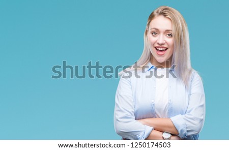 Young blonde woman over isolated background happy face smiling with crossed arms looking at the camera. Positive person.