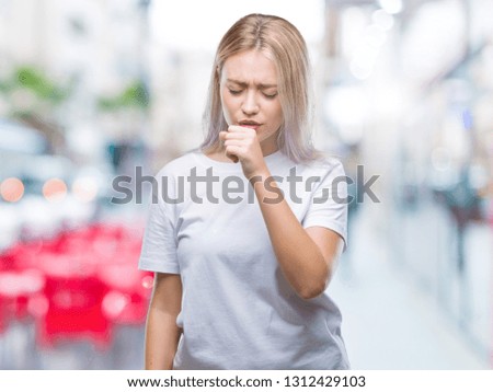 Young blonde woman over isolated background feeling unwell and coughing as symptom for cold or bronchitis. Healthcare concept.