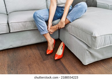 Young Blonde Woman With Pain On Feet At Home