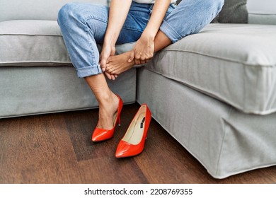 Young Blonde Woman With Pain On Feet At Home