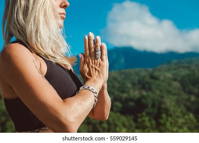 Young Blonde Woman Practicing Yoga And Meditation In Mountains During Luxury Yoga Retreat In Bali, Asia