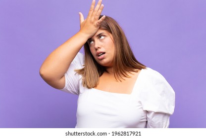 Young Blonde Woman Raising Palm To Forehead Thinking Oops, After Making A Stupid Mistake Or Remembering, Feeling Dumb