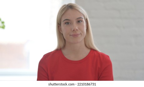 Young Blonde Woman Shaking Head As No Sign