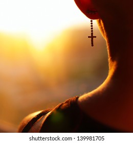 Young Blonde Woman Staying Back Of The Head In Summer Light