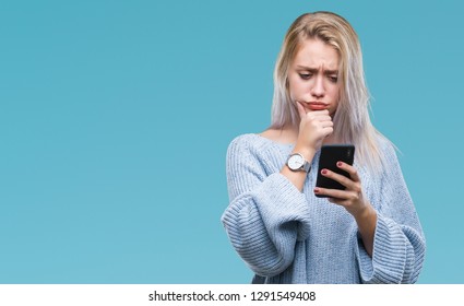 Young blonde woman texting sending message using smartphone over isolated background serious face thinking about question, very confused idea - Powered by Shutterstock