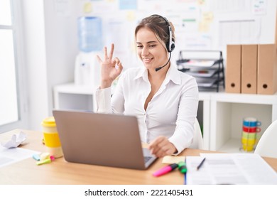 Young Blonde Woman Wearing Call Center Agent Headset Doing Ok Sign With Fingers, Smiling Friendly Gesturing Excellent Symbol 