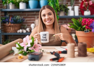 Young Blonde Woman Working At Florist Shop Holding I Am The Boss Cup Smiling Happy Pointing With Hand And Finger 