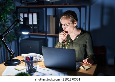 Young Blonde Woman Working At The Office At Night Feeling Unwell And Coughing As Symptom For Cold Or Bronchitis. Health Care Concept. 