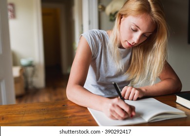 Young Blonde Woman Writing Notes