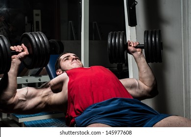 Young Bodybuilder Doing Bench Press For Chest