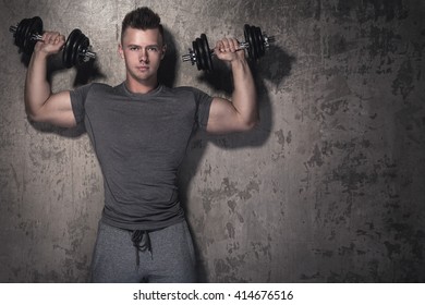 Young Bodybuilder Doing Overhead Press Exercise