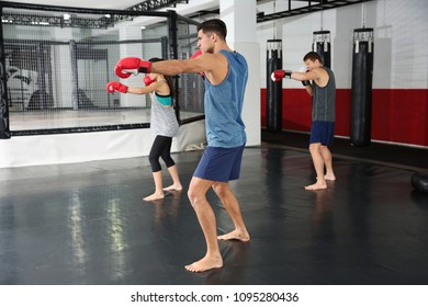 Young boxers warming up before training in gym - Powered by Shutterstock