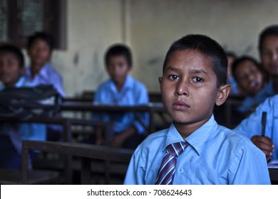 A YOUNG BOY ATTENDING A CLASS IN A SCHOOL, KATHMANDU, NEPAL - OCTOBER 21, 2013: A child attending school in Kathmandu, Nepal - Shutterstock ID 708624643