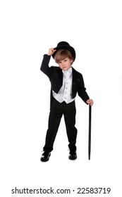 young boy in black tuxedo tipping his top hat