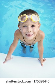 A Young Boy In A Blow Up Pool