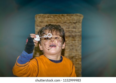 Young Boy Blowing Bubbles. Studio Shot. Isolated. Stock Image.