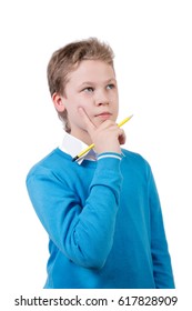 Young boy in blue pullover in pensive pose. Schoolboy with pancil isolated on white background.