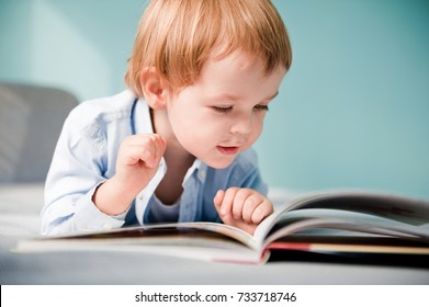 Young boy with book.