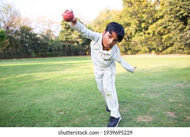 Young boy bowling leg spin in a cricket - Powered by Shutterstock