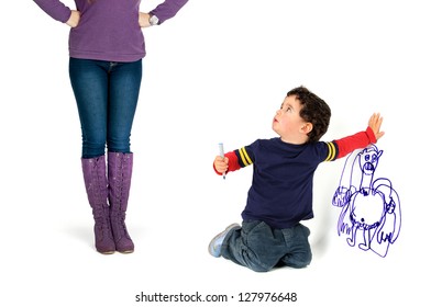 Young Boy Caught By His Mother Painting The Wall