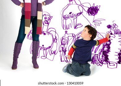 Young Boy Caught By His Mother Painting The Wall