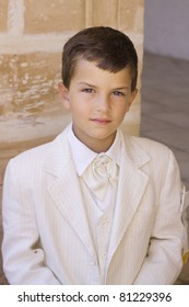 A Young Boy Celebrating His First Holy Communion