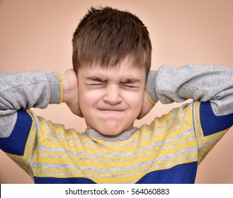 Image result for child crying, covering eyes and ears