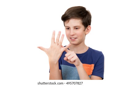 A Young Boy Is Counting His Own Fingers, Isolated On White Background