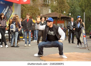 Young Boy Dancing Break Dance On The Street, Crowd Of People Watching. October 21, 2012. Kyiv, Ukraine